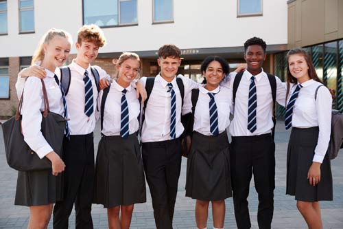 Schoolkids amiling in a group